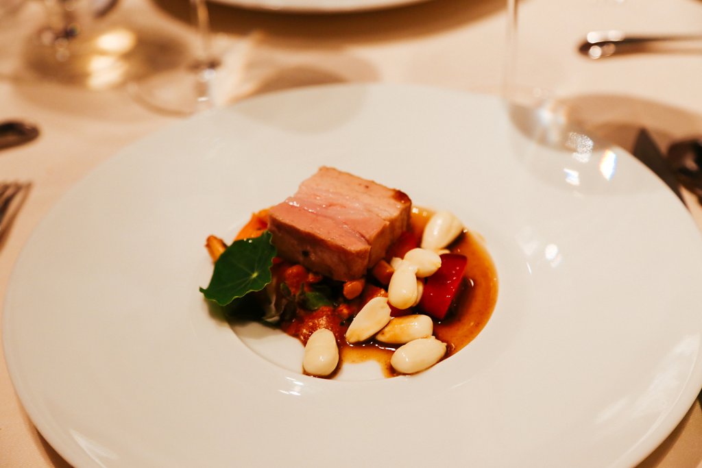 Pork belly confit with chanterelles, raw almonds, and apricots
