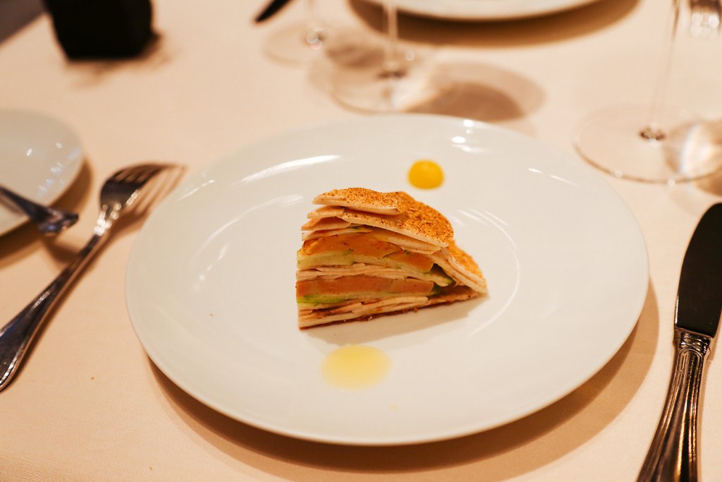 A millefeuille-like galette of foie gras, green apple and mushrooms (all raw); hazelnut vinaigrette and lemon confit